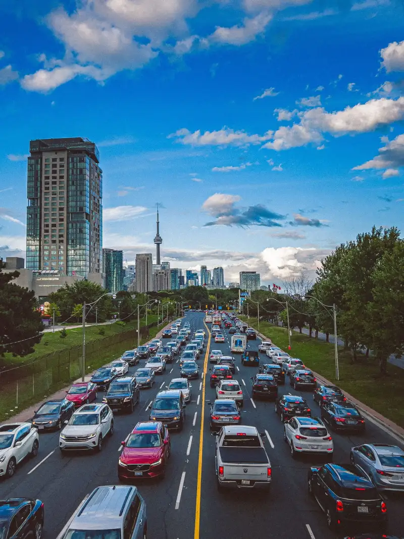 Toronto skyline and the CN Tower above traffic on Lake Shore Boulevard